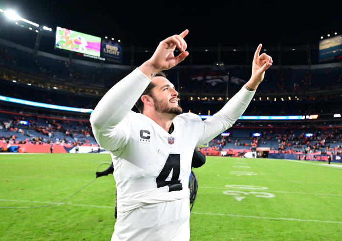 Raiders quarterback Derek Carr celebrates after his team's overtime win against the Broncos in Week 11.